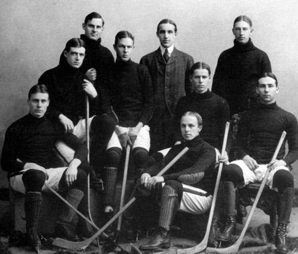 A historical photo of a group of hockey players posing for a team photo.