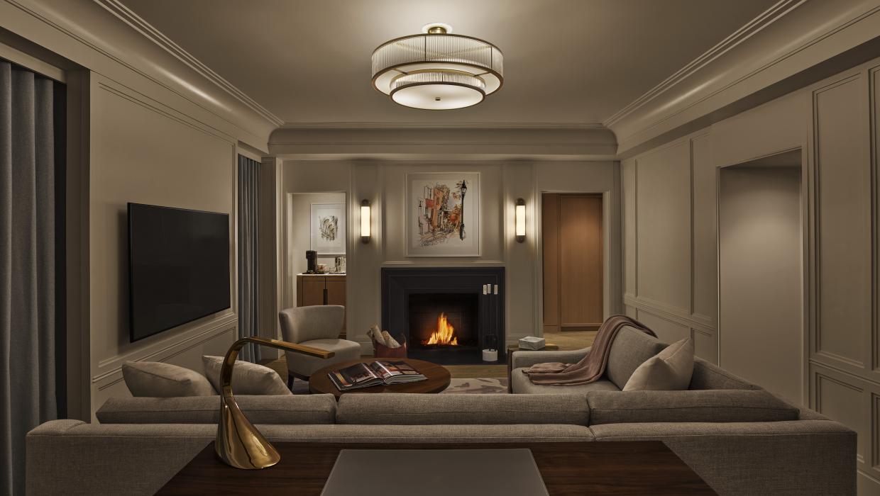 A classic corner suite with a park view and fireplace, at The Newbury Boston