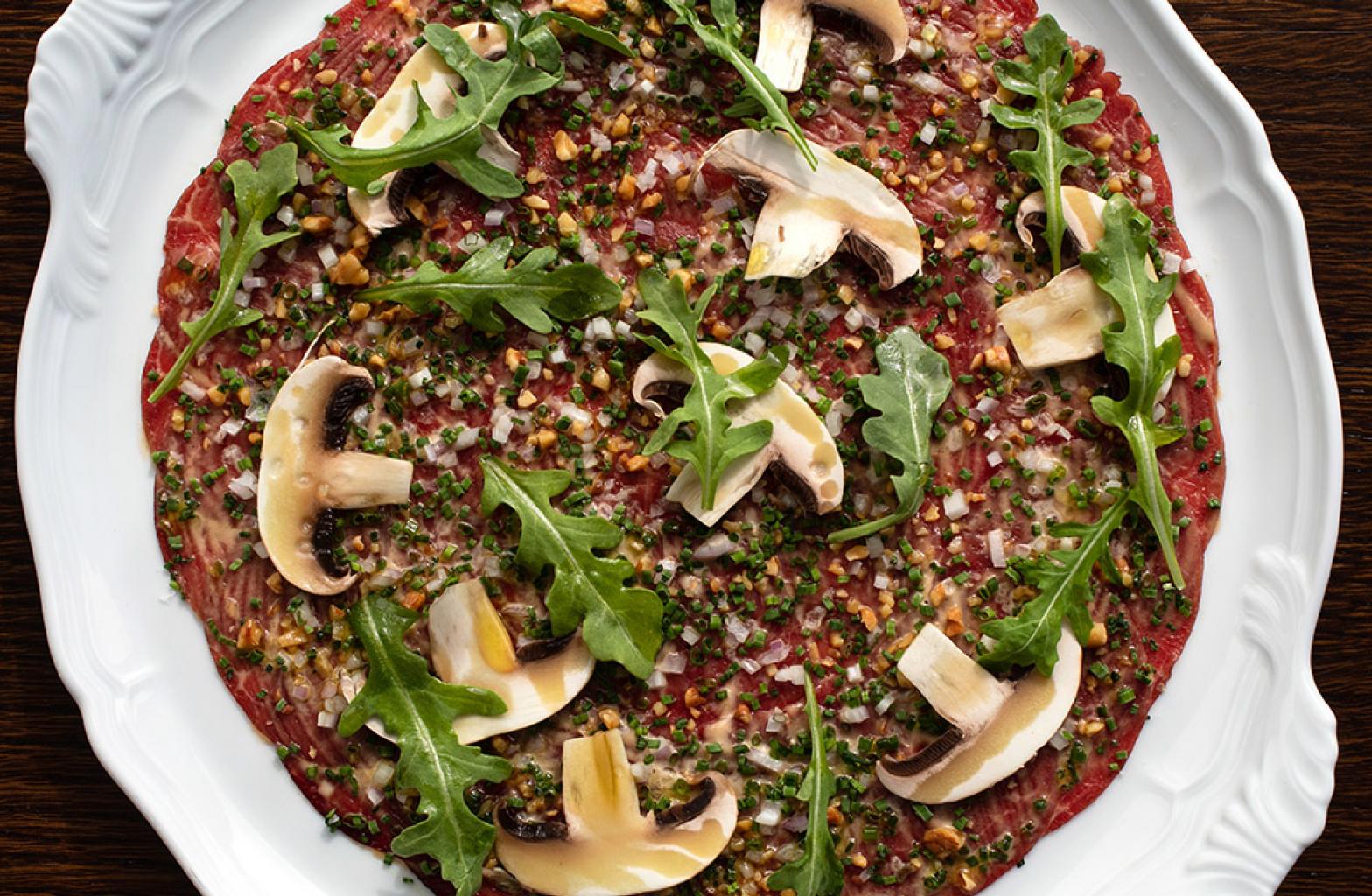 A plate of food with mushrooms at The Contessa in The Newbury Boston