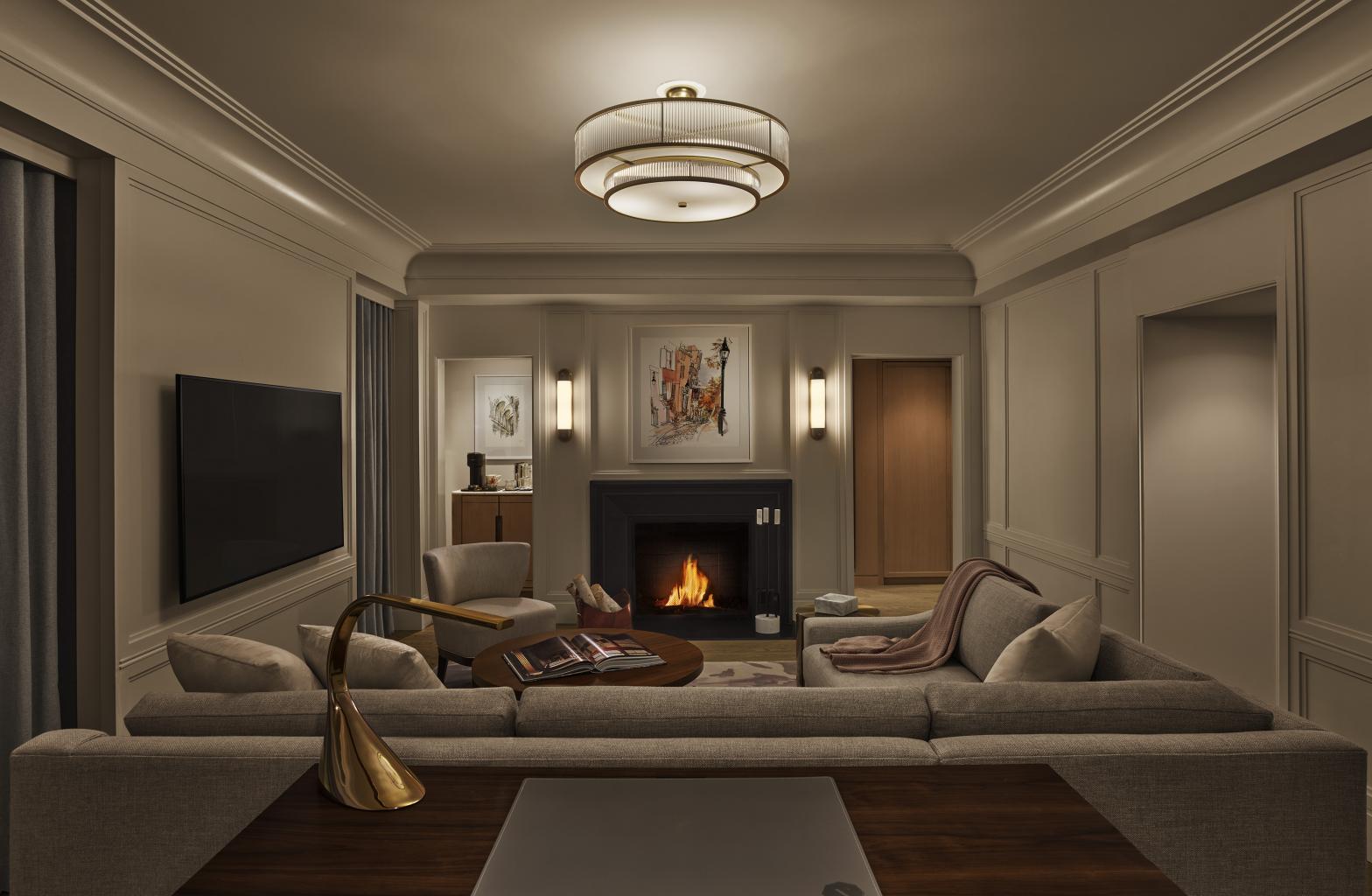 A classic corner suite with a park view and fireplace, at The Newbury Boston