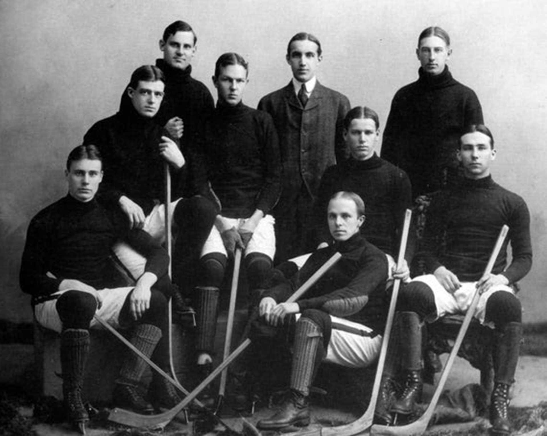 A historical photo of a group of hockey players posing for a team photo.