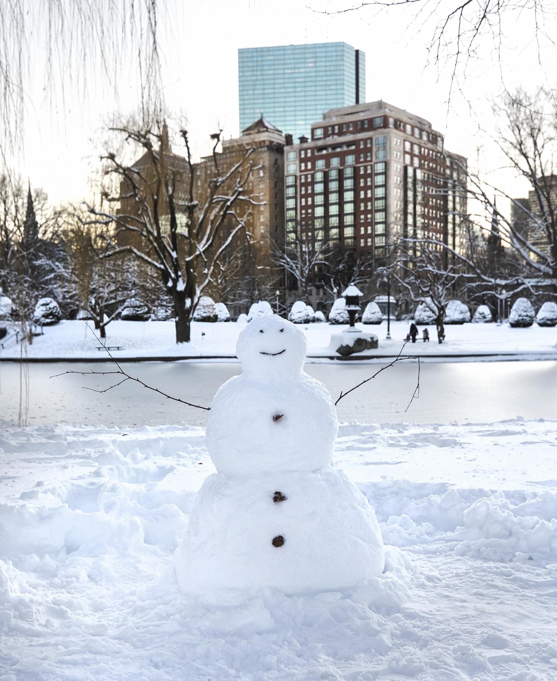 A snowman in The Boston Commons near The Newbury Boston