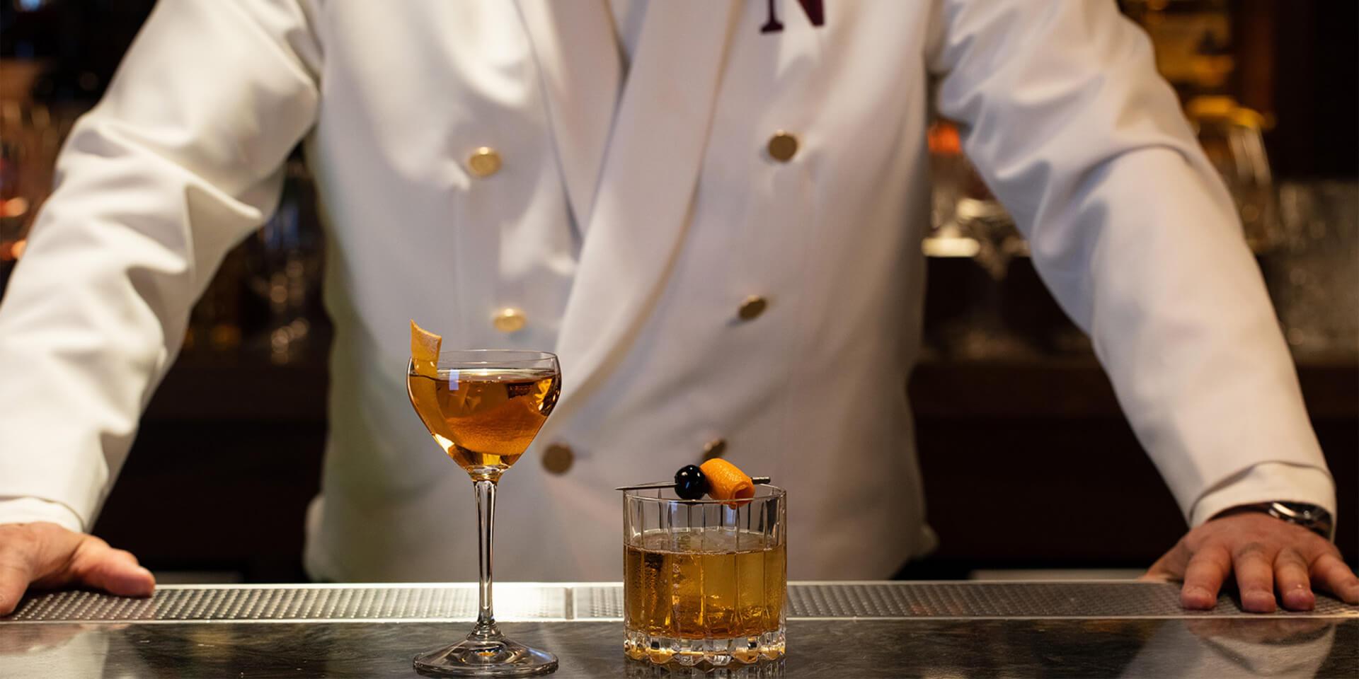 Bartender presenting drinks