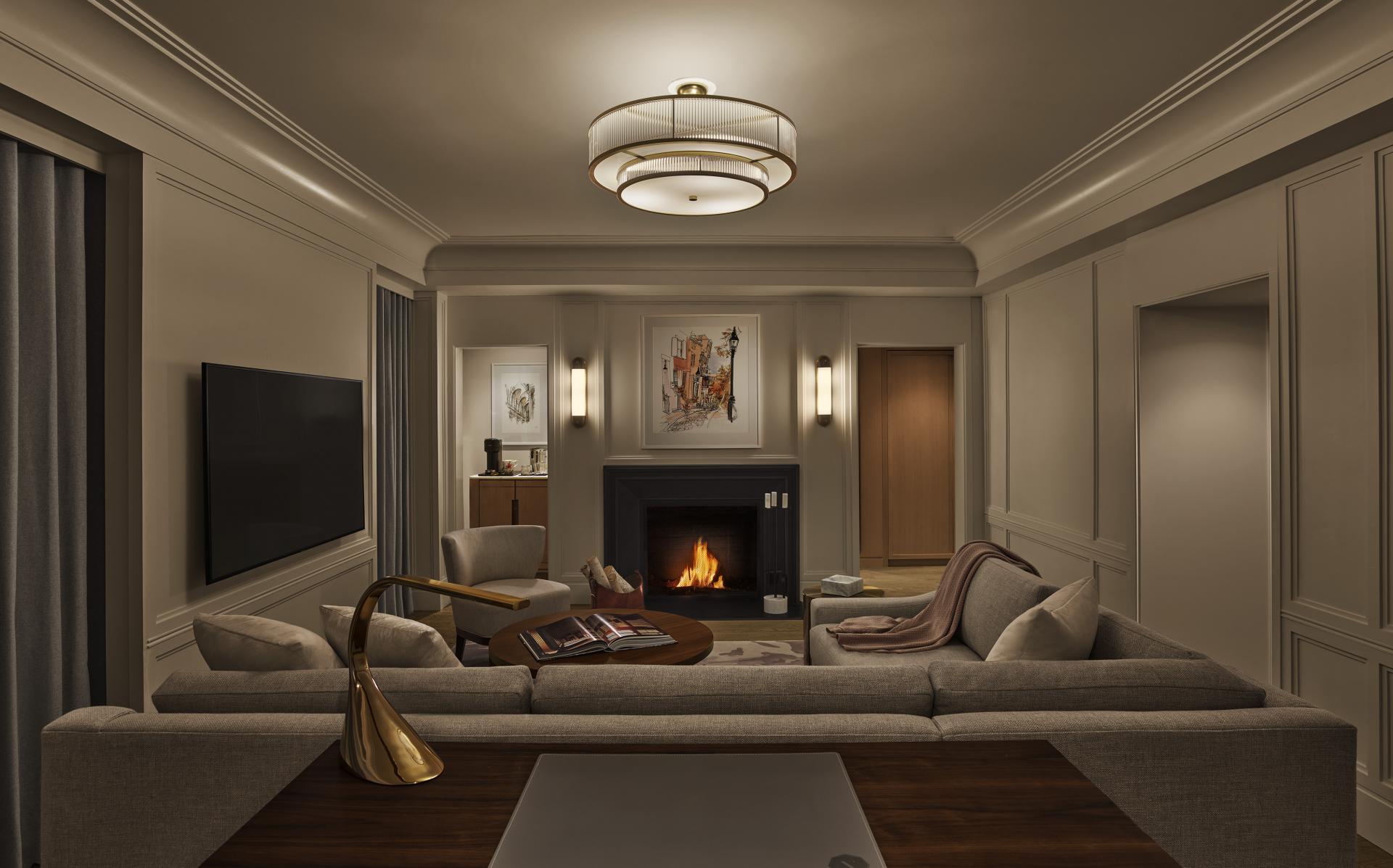 A classic corner suite with a park view and fireplace, at The Newbury Boston