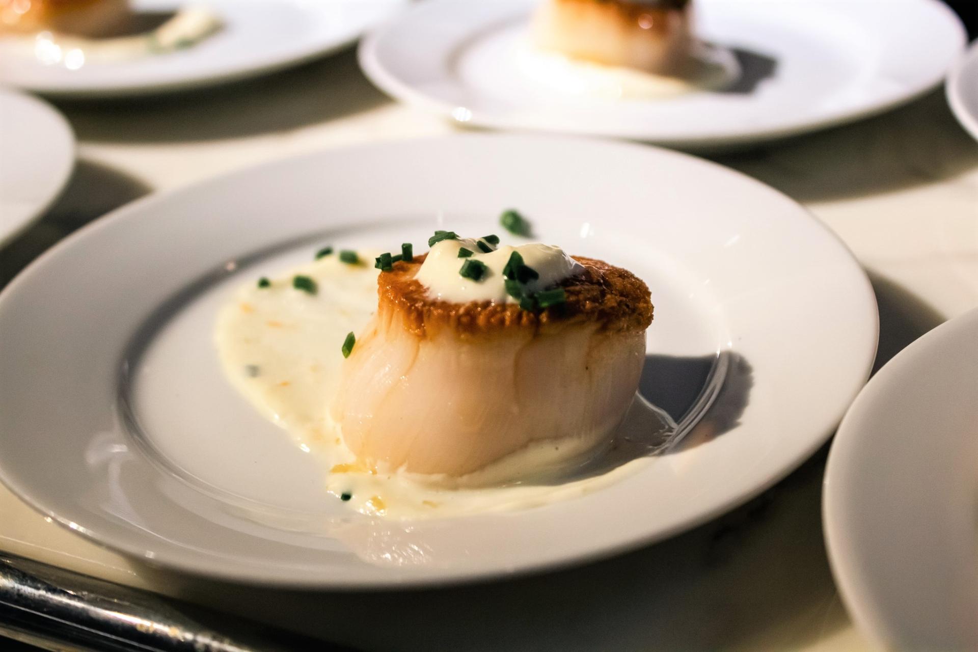 Scallop dish at an event at The Newbury Boston