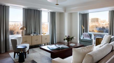 Stylish living area with couches, chairs and coffee table.