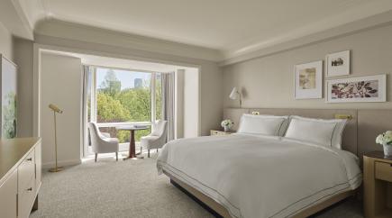 A guest room with a king-sized bed at The Newbury Boston